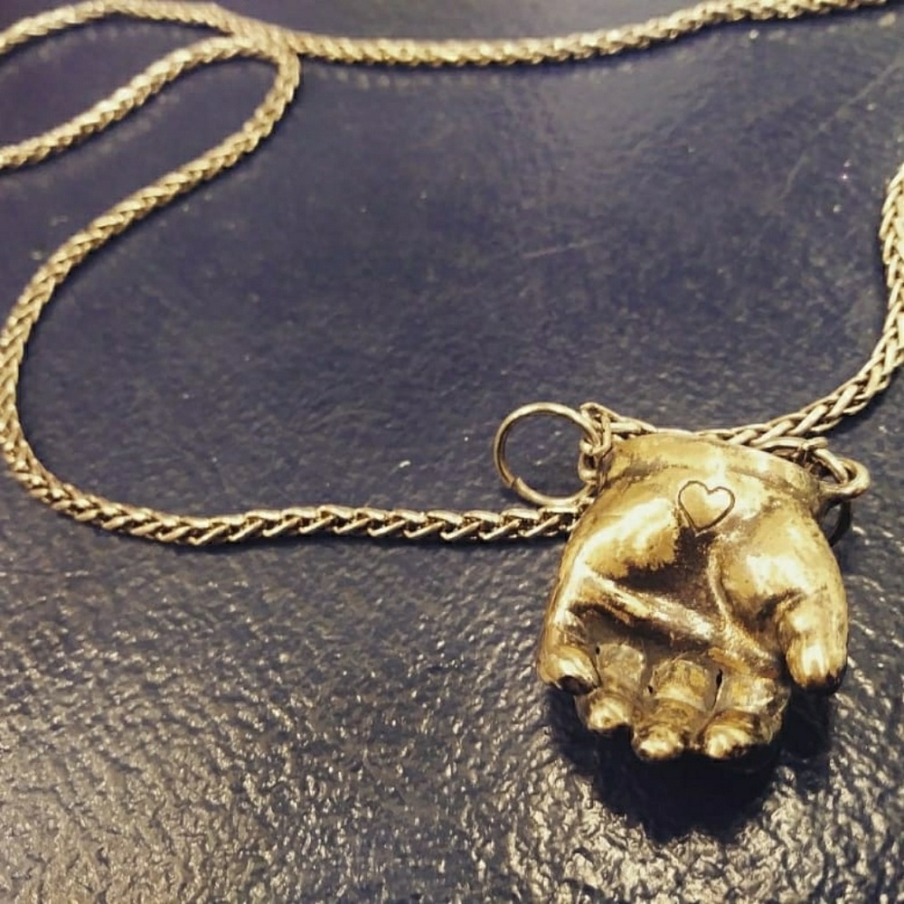 Bronze hand-casted babydoll hand pendant